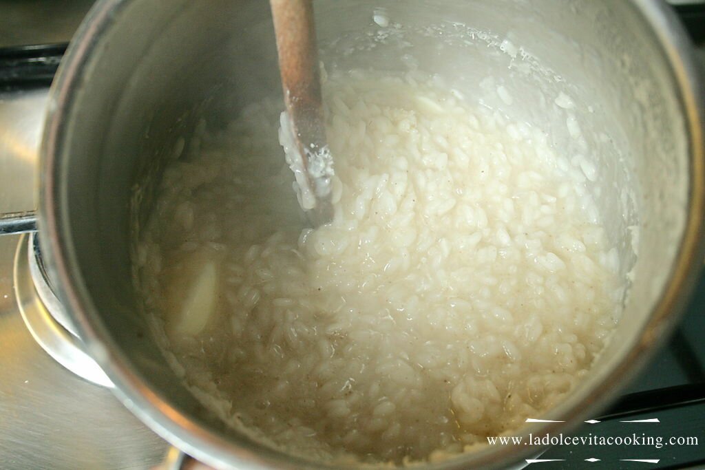 Stir the rice with butter and Parmesan Cheese