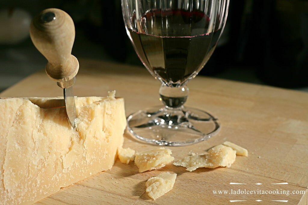 Parmesan cheese with a glass of red wine