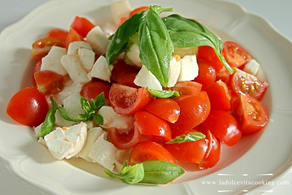 A mix of tomato, mozzarella and basil